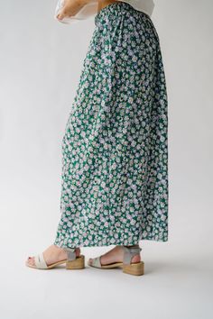 Get ready to bloom in style with the Myrick Floral Pleated Midi Skirt in Green! This flowy skirt features a beautiful floral print and elegant pleats that will add movement to your every step. Perfect for any occasion, this skirt will make you feel both playful and sophisticated. Details self/lining: 100% polyester Fabric Care Guide Here Sizing & Fit Measurements are approximate and taken while laying flat across the front. Not doubled. x-small: waist = 13"; length = 35" small: waist = 14"; leng Piper And Scoot, Flowy Skirt, Pleated Midi Skirt, Small Waist, Cardigan Jacket, Light Weight Sweater, Stripe Sweater, Sweater Vest, Make You Feel