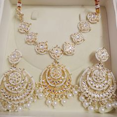 Title: "Exquisite Indian Jewelry: Kundan Necklace Set for Bridal Elegance" Step into the enchanting world of Indian tradition with our Kundan Necklace Set, meticulously crafted to adorn you with timeless elegance and grace. Inspired by the opulence of Indian weddings and the richness of ethnic bridal attire, this exquisite ensemble is a tribute to the beauty of tradition and culture. Indulge in the allure of our Ethnic Bridal Necklace, meticulously designed to complement your bridal attire with Traditional Silver Anarkali Set For Eid, Eid Wedding Bridal Necklace With Cutdana, Bollywood Bridal Sets For Wedding And Eid, White Bridal Sets For Eid Festive Occasion, White Bridal Sets For Eid Festivities, Bollywood Style Hand Set Tikka For Festivals, White Jewelry Sets For Wedding On Eid, Bollywood Style Wedding Tikka For Eid, Chandbali Bridal Necklace For Eid Wedding