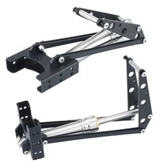 two black metal brackets with one holding the other's arm and another attached to it