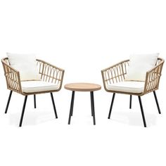 two chairs and a table with white cushions