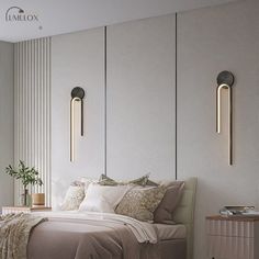 a bedroom with a bed and two lamps on the wall next to it's headboard