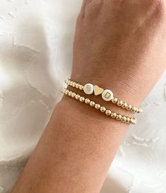 CUSTOM LISTING 1x - 14K gold filled bracelet in 4mm bead size 1x - 14K gold filled bracelet with a gold heart and initials B and D B And D, Bracelet With Pearls, Gold Heart, Heart Of Gold, Stretch Bracelet, Stretch Bracelets, Delicate Bracelet, Gold Filled, San Diego