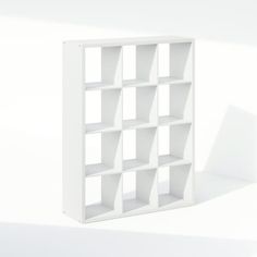 a white bookcase with several open sections