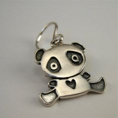 Sweet solid sterling silver Panda earrings to last a lifetime!  They are 1/2 of an inch tall and made completely from sterling silver with solid sterling French ear wires. Adorable!To see all my sterling silver charm earrings go here:https://www.etsy.com/shop/marmar?ref=hdr_shop_menu&section_id=5064601For the large matching necklace:http://www.etsy.com/listing/94186350/panda-bearFor the small matching necklace:http://www.etsy.com/listing/91509033/baby-panda-necklaceFor the mother-daughter se Cute Nickel-free Pendant Jewelry, Cute Sterling Silver Earrings With Ear Wire, Sterling Silver Hypoallergenic Pendant Earrings, Cute Nickel-free Sterling Silver Jewelry, Cute Handmade Sterling Silver Jewelry, Handmade Cute Sterling Silver Jewelry, Cute Sterling Silver Nickel-free Jewelry, Nickel-free Cute Sterling Silver Jewelry, Cute Sterling Silver Dangle Earrings