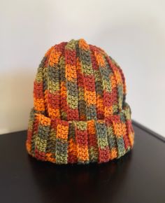 a crocheted hat sitting on top of a table