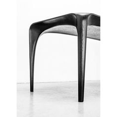 a black and white photo of a chair