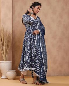 This is a beautiful 3-piece anarkali suit set. The set includes anarkali kurta with 32 kali has round neck, 3/4th sleeves & calf length teamed with solid cotton pants with elasticated waistband and a cotton printed dupatta with lace detailing. 3-piece set Suit Fabric-Cotton Dupatta Fabric-Cotton Length-Calf Length Color - Blue & White Neck-Round Neck Sleeves - Sleeves Washing Care-Dry Clean or Quick Deep Wash DISCLAIMER - The color of the product may be differ due to screen settings of device. Anarkali Style Indigo Wedding Sets, Indigo Anarkali Traditional Wear For Navratri, Unstitched Anarkali Set For Navratri, Anarkali Kurta With Dabka For Navratri, Indigo Anarkali For Navratri, Indigo Anarkali Sets With Resham Embroidery, Festive Indigo Anarkali Set With Dupatta, Anarkali Style Palazzo Set With Dupatta, Mulmul Anarkali Set With Sheer Dupatta