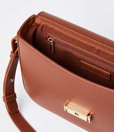 Topped with an extra stylish and sleek clasp closure, this perfectly practical bag is a modern must-have. Shoulder strap with 18" drop. Inside zip pocket. 7 1/2" x 6 1/4" x 1 3/4".,Imported:Imported Loft Modern Shoulder Bag Cognac Women's by Loft Size Regular - One Size Cognac Women's Bags, &, Clutches, Crossbody, Bags Loft Modern, Practical Bag, Small Accessories, Backpack Purse, Women's Bags, Small Bags, Cognac, Effortless Style, Clutches