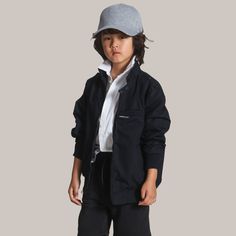 Introducing the Members Only Boy's Iconic Racer Jacket – the pint-sized version of the legendary classic. Crafted to be gender neutral and with the same timeless style, it’s the perfect blend of durability and flair. With the signature shoulder epaulettes and sleek zippered pockets, your kid will be the most legendary icon on the playground. Parents, here’s the pro tip: size up from their usual size to keep the style rolling as they grow. Because legends aren’t just born, they’re nurtured – and Classic Everyday Outerwear With Ribbed Cuffs, Classic Track Jacket With Ribbed Cuffs For Streetwear, Classic Streetwear Track Jacket With Ribbed Cuffs, Men’s Racer Jacket, Style Help, Shoulder Epaulettes, Just Born, Racer Jacket, Members Only