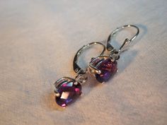 Use coupon SALE18 for 18% off all merchandise. These genuine African AAA Amethyst dangle drop lever-back or stud earrings have beautiful AAA colors in purple/mauve color tones. The natural mined Checkerboard cut oval 8x6mm size is approximately 2.50 total carat weight in the pair. The clarity is VVS excellent eye clean. The color is outstanding and the faceting creates beautiful sparkle. The gemstones are guaranteed genuine natural earth mined quality AAA VVS clear Zambia, Africa Amethysts. *set Nickel-free Pear-shaped Earrings For Gifts, Teardrop Earrings With Bail As Gift, Oval Jewelry For Pierced Ears, Anniversary Gift, Sterling Silver Drop Earrings With Bail, Sterling Silver Teardrop Jewelry With Bail, Zambia Africa, Purple Mauve, Mauve Color, Color Tones