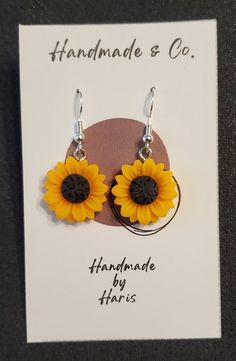 Delicately made polymer clay sunflower. Each one is slightly unique due to the handmade nature, but each consistently showcase a beautiful sunflower. Metal findings are sterling silver, and all our jewelry is lead and nickel free! Hypoallergenic Flower-shaped Polymer Clay Jewelry, Yellow Sunflower Dangle Earrings, Yellow Sunflower Design Dangle Earrings, Everyday Yellow Polymer Clay Jewelry, Yellow Polymer Clay Earrings With Ear Wire, Yellow Flower-shaped Polymer Clay Earrings, Adjustable Polymer Clay Flower Earrings, Everyday Dangle Polymer Clay Flower Earrings, Everyday Dangle Flower Earrings In Polymer Clay