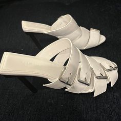 New Edgy Balenciaga White Leather Sandals With Straps With Silver Metal Buckles. Heels Are Black. Approx Height 4”. Size 35. -Serious Bidders Only! My Items Are 100% Authentic. Please Ask If You Have Additional Questions Or Would Like More Photos. Chic White Mules With Heel Loop, Designer White Sandals With Heel Loop, White Heels With Buckle Closure And Single Toe Strap, Designer White Heels With Heel Loop, Designer White Open Heel Mules, Designer Heels With Strap For Summer, Designer Strap Heels For Summer, Designer Strappy Heels For Summer, Designer High Heel Mules With Buckle Closure