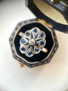 1930s Antique Art Deco Navette Ring with Diamond & Sapphires This elegant ring is an original Art Deco piece dating back to 1930s. It will make a lovely engagement ring or simply a one-of-a-kind addition to your collection! ABOUT THE RING: -Band: 18K Solid Yellow Gold -Setting: 18K Solid White Gold -Setting Measurements: 1.7 x 1.3 x 0.4 Cm Approx -4.1gr -Diamond: Natural, Old Cut Diamond (0.10 ct) -Color/Clarity: H-I-J VS-SI 1-2 -Gemstones: Sapphires (0.40ct) -Diameter: 19.5 Mm Size: US 9 1/2. C 1930s Engagement Ring, 1930 Jewelry, Navette Ring, Sapphire Antique Ring, 18k Gold Engagement Ring, Art Deco Sapphire Ring, Raw Diamond Engagement Rings, Gold Sapphire Ring, Unique Engagement Ring