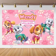 a pink wall with three cartoon dogs and paw patrol characters on it's side