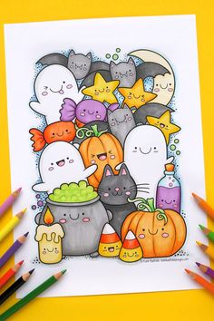 a halloween coloring page with lots of cats and pumpkins in the background, surrounded by colored pencils