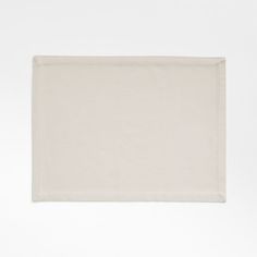 an empty white place mat on a white background