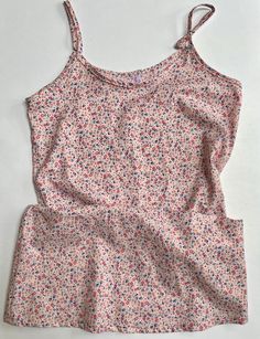 "Comfy  slip dress/night gown to lounge around in.   Cotton lawn fabric is very soft and airy. A sweet and dainty floral print on a pink background.  Loose fitting with adjustable shoulder straps. Top of neckband to bottom of hem is 25 3/4 inches (65.4 cm) Size Small (38) - fits bust from 33.5\" to 34.6\" (85 cm to 88 cm) Material has been pre-washed.   Wash separately on a gentle cycle and hang to dry." Pink Floral Print Sleepwear For Spring, Spring Floral Print Pink Sleepwear, Spring Pink Floral Print Sleepwear, Summer Bedtime Cami Dress, Summer Camisole For Sleepover, Spring Cami Nightgown For Bedtime, Pink Camisole Slip Dress For Bedtime, Spring Sleeveless Slip Dress For Bedtime, Spring Sleeveless Bedtime Slip Dress