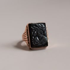 Luxury Black Enamel Onyx Signet Ring, Luxury Vintage Rings With Black Enamel, Luxury Vintage Cameo Signet Ring, Classic Black Onyx Rings, Luxury Black Engraved Ring For Formal Occasions, Formal Black Onyx Ring, Formal Black Engraved Ring, Black Intaglio Jewelry As A Gift, Elegant Black Engraved Ring For Formal Occasions