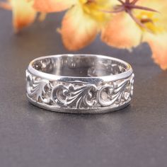 "Unique 925 sterling silver womens filigree wedding band, Simple & elegant art nouveau wedding band for her, Dainty art deco wedding band This is a stunning, feminine ring that works well for all occasions, styles, and ages. You will love it! Ring information Metal type: Silver Metal stamp: 925 Sterling SIlver Customization / Replacements It's easy to create jewelry that's perfect for you. Change the materials to suit your style and budget: Ruby, Emerald, Blue Sapphire, Amethyst, Topaz, Garn Vintage Wide Band Jewelry With Intricate Design, Elegant Wide Band Ring Stamped 925, Sterling Silver Wide Band Wedding Jewelry, Elegant Silver Wide Band Jewelry, Wedding Jewelry With Intricate Design And Wide Band, Wedding Jewelry With Intricate Wide Band Design, Intricate Design Wide Band Wedding Jewelry, Elegant Silver Engraved Ring With Open Band, Elegant Wide Band Filigree Ring With Intricate Design