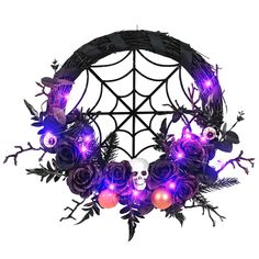 a purple wreath with skulls, roses and balls in the shape of a spider web