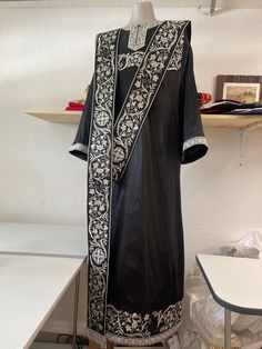 Orthodox deacon vestments set. Fully embroidered, made from silk. It includes stikharion, cuffs and orarion. After the order we will ask your measurements. It takes about four week to produce it and ship to you. We locate in FL, USA. Traditional Black Agbada For Ceremonies, Traditional Black Embroidered Thobe, Elegant Black Agbada For Wedding, Ceremonial Black Kurta With Gold Embroidery, Black Traditional Wear With Embroidered Border For Ceremonial Occasion, Black Kurta With Gold Embroidery For Ceremonial Occasions, Ceremonial Black Kurta With Traditional Patterns, Black Silk Traditional Wear For Ceremonial Occasions, Traditional Silk Abaya