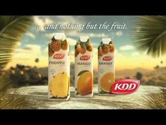 an advertisement for kodak fruit juice with oranges and pineapple