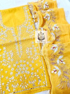 Item Overview ATHARVA Hand Embroidery Salwar Kameez/Yellow Chanderi/Elgant Gota Patti Border Chiffon Dupatta/Custom Stitch Unstitch/Custom Anarkali Dno. CH1710 Fabric: * Shirt Chanderi Silk 2.5 Mts, yellow/Neck Embroidery * Dupatta:Chiffon Chinnon, Yellow, Elegant Gota Patti border Dupatta 2.5 Mts. * Bottom Santoon Silk 2.5 Mts. Excusive Hand Embroidered Party Wear Punjabi Suit. Customization: * Fabrics Customization: Designs Can be made in different Fabrics. *Color Customization: Designs Can be Yellow Bollywood Style Kurta With Cutdana, Yellow Bollywood-style Kurta With Cutdana, Yellow Bollywood Kurta With Cutdana, Bollywood Style Yellow Kurta With Cutdana, Yellow Chanderi Kurta With Cutdana, Yellow Kurta With Mirror Work For Navratri, Yellow Chanderi Kurta With Mirror Work, Yellow Sharara With Cutdana And Straight Kurta, Yellow Sharara With Straight Kurta And Cutdana Details