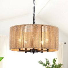 a chandelier hanging from the ceiling in a living room