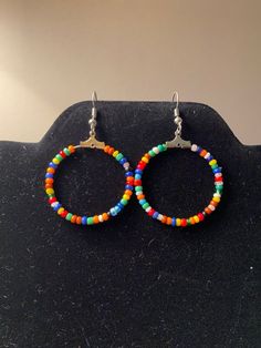 Bohemian Mixed Seed Bead Hoop Earrings | Etsy Bohemian Beaded Small Hoop Earrings With Ear Wire, Bohemian Small Hoop Beaded Earrings With Ear Wire, Bohemian Multicolor Hoop Earrings, Multicolor Nickel-free Hoop Earrings For Festivals, Colorful Bohemian Hoop Jewelry, Bohemian Heishi Beads Small Hoop Earrings, Bohemian Small Hoop Heishi Bead Earrings, Small Hoop Beaded Earrings With Tiny Beads For Festival, Adjustable Multicolor Bohemian Hoop Earrings