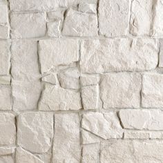 a white brick wall that has been made out of cement blocks and is being used as a background