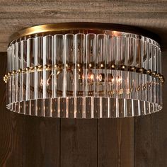 a chandelier hanging from a wooden ceiling