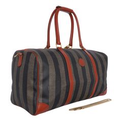 Authentic Fendi vintage brown duffle travel bag. Features exterior canvas, leather trim, gold-tone hardware, large interior with zipper pocket, and dual rounded handles. Handle drops: 9", 22" Made in Italy FAA approved as a carry-on Landfill Waste, Fendi Vintage, Leather Formal Shoes, Weekend Travel, Formal Shoes For Men, Mens Formal, Iconic Bags, Unique Accessories, Bag Packaging