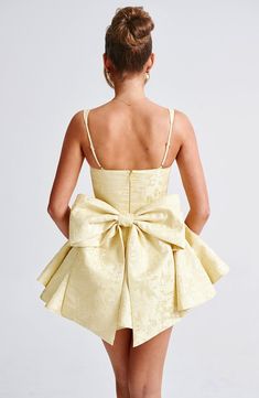 Give us all the pretty playsuits this season! Emelie is made from a premium jacquard fabric with an all-over floral design, cinching at the waist and flaring gently at the skirt which has in-built shorts. With an underwired, balconette bust and lace trim detail, the look is complete with a dramatic oversized bow at the back which you can remove. 



Colour: Lemon.

Floral jacquard fabric.

Fully lined.

Underwired, balconette bust.

Boning in bodice.

Waist cinching.

Adjustable straps.

Lace tr Shorts Under Skirt, Homecoming Dresses Corset, White Dress Spring, Midi Dress Wedding Guest, Dresses Flowy, Split Long Dress, Maxi Dress Sale, Sparkle Dress, Maxi Dress Navy