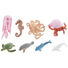 small plastic sea animals and an octopus on a white background