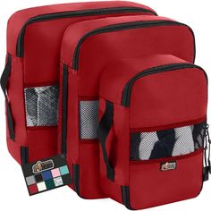 two pieces of red luggage with zippers on each side and pockets for clothes in the middle