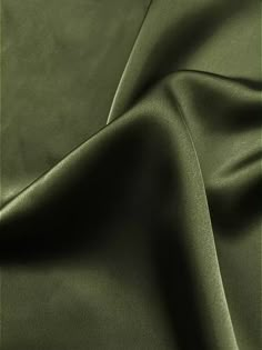 a close up view of a green satin fabric