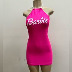 a mannequin wearing a pink bathing suit with the word barbie written on it