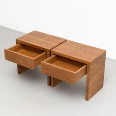 two wooden tables with one drawer open and the other turned upside down on its side