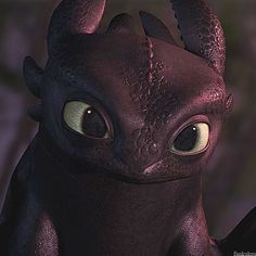 a close up of an animated toothless dragon with big eyes and large horns on it's head