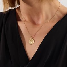 Wear a symbol of divine protection with the Saint Christopher Coin Necklace. Featuring a finely detailed depiction of Saint Christopher, the patron saint of travelers, this necklace serves as a protective talisman and a stylish accessory, offering a unique blend of faith and fashion for everyday wear. - Made in 14k Solid Gold - Pendant: 15.83X15.83 mm / 0.623x0.623 inches - Thickness: 0.72 mm / 0.028 inches - This product comes with iconic Norm Jewels gift box Yellow Gold Amulet Medallion Necklace, Spiritual Yellow Gold Medallion Necklace With Large Pendant, Yellow Gold Amulet Style Medallion Necklace, Good Luck Coin Pendant Medallion Jewelry, Spiritual Oval Coin Pendant Medallion Necklace, Spiritual Medallion Necklace With Oval Coin Pendant, Good Luck Coin Pendant Jewelry, Good Luck Medallion Coin Pendant Jewelry, Celestial Necklaces For Meditation