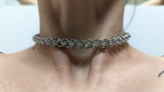 This chain maille choker is made with stainless steel for a bright silver exterior and features "hidden" captive beads that add a sparkle from the interior. Perfect as an accessory to any outfit this choker can be dressed up or worn everyday. The piece measures 12 inches with an additional 1.5 inches of adjustable room.  If you need a different length please reach out to me, I can always shorten chain maille however, depending on the availability of materials lengthening them is not always possi Metal Chainmail Choker As A Gift, Silver Chainmail Necklaces, Silver Chainmail Necklace With Chain Link, Silver Stainless Steel Choker With Adjustable Chain, Hypoallergenic Silver Choker Jewelry, Round Chainmail Metal Jewelry, Round Metal Chainmail Jewelry, Nickel Free Metal Choker, Silver Chainmail Choker As A Gift