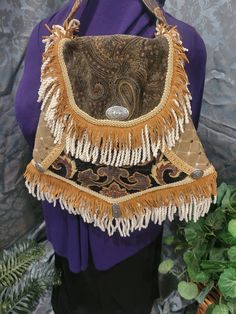 This stunning boho crossbody handbag has an extra long strap. Made from very durable materials with exterior and interior pockets It has a magnetic closure. . Bohemian Fringe Shoulder Bag, Western Brown Bag With Fringe, Bohemian Brown Fringe Satchel, Boho Handbag, Western Crossbody Purse Leather Fringe, Cowhide Fringe Crossbody Bag, Boho Handbags, Western Boho, Sling Bags