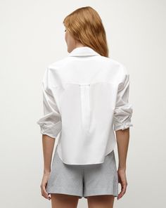 Endlessly versatile, the Khai is the go-to top every woman needs—perfect on its own or as a layering essential. Expertly tailored from premium cotton poplin—with stretch for ease—this billowy, relaxed silhouette is finished with a neat collar, a split V-neck and a single patch pocket. Throw it on over jeans, skirts, shorts—you name it.67% Cotton, 30% Polyamide, 3% SpandexProfessional dry clean onlyStyle #2312LSCP40714 Modern Tops With Shirttail Hem For Daywear, Relaxed Fit Blouse With Fold Down Collar For Daywear, Chic Cotton Shirt For Layering, Effortless Everyday Top With Spread Collar, Effortless Everyday Tops With Spread Collar, Classic Poplin Tops For Fall, Chic Blouse With Spread Collar For Everyday, Solid Cotton Blouse For Layering, Effortless Cotton Tops For Work