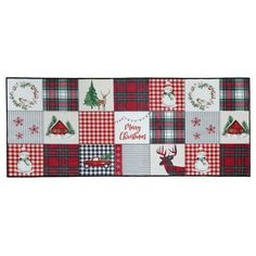 a red and white plaid christmas table runner with reindeer, snowflakes, wreaths and trees on it