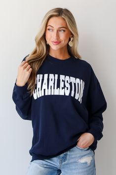 Calling all Charleston residents, the Navy Charleston Sweatshirt was made just for you! This comfy sweatshirt is designed with a soft and stretchy knit with a fleece interior. It features a crew neckline, long sleeves, a relaxed fit, and the word "Charleston" on the front. Style the Navy Charleston Sweatshirt with your favorite denim and sneakers for a casual look! Soft + Stretchy Knit Fabrication Fleece Interior "Charleston" Graphic Crew Neckline Long Sleeves Relaxed Fit 80% Cotton, 20% Polyest Long Sleeve Sweater With Ribbed Cuffs For Game Day, Varsity French Terry Crew Neck Sweatshirt, French Terry Long Sleeve Sweatshirt For College, Long Sleeve French Terry Sweatshirt For College, Game Day Crew Neck Sweater With Ribbed Cuffs, Stretch Crew Neck Sweatshirt For Fall, Fall Varsity Sweatshirt In French Terry, Varsity French Terry Sweatshirt For Fall, Game Day Long Sleeve Letter Print Sweater