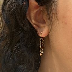 Dazzle up your favorite look with our Sparkle Chain Studs. We love to pair these with our sequin ear cuff for extra shine. Measures approx. 1.25" long14K Gold Filled. Adjustable Hypoallergenic Gold Linear Earrings, Gold Dangle Cartilage Earrings For Party, Gold Hypoallergenic Dangle Cartilage Earrings, Hypoallergenic 14k Gold Ear Cuff, Trendy Gold Dangle Cartilage Earrings, Gold Cartilage Earrings With Adjustable Chain, Trendy Gold Threader Earrings For Everyday, Gold Hypoallergenic Dangle Threader Earrings, Hypoallergenic 14k Gold Filled Threader Earrings