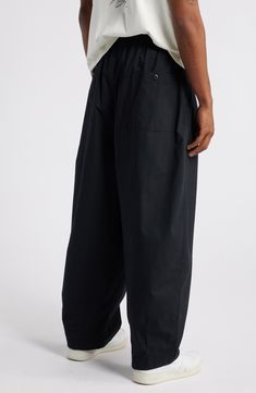 Volumize your look with these pleated and billowy balloon-leg pants that are made from cotton poplin and feature roomy pockets to further the theme. 28 1/2" inseam; 20" leg opening; 15 1/2" front rise; 18 1/2" back rise (size Medium) Elastic/drawstring waist with button closure Faux fly Side-seam pockets; back button-patch pockets 100% cotton Machine wash, tumble dry Imported Nike Cotton Relaxed Fit Cargo Pants, Nike Cotton Cargo Pants With Relaxed Fit, Nike Casual Relaxed Fit Parachute Pants, Nike Relaxed Fit Cotton Cargo Pants, Nike Cotton Bottoms With Relaxed Fit, Nike Relaxed Fit Bottoms With Cargo Pockets, Nike Relaxed Fit Tapered Leg Pants, Nike Relaxed Fit Pants With Side Pockets, Nike Cotton Cargo Pants For Streetwear