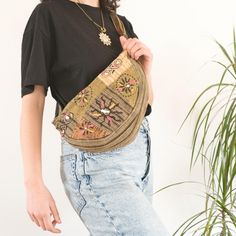 Embrace your inner free spirit with our Safari Green Handmade Patchwork Crossbody Bag! This unique bag is a beautiful blend of hippie and boho vibes, crafted with love in Nepal by skilled artisans. We use up-cycled cotton fabrics to create a one-of-a-kind patchwork design that's both vibrant and eco-friendly. 🌼 PRODUCT DETAILS: - Lovingly Handcrafted in Nepal - Made from 100% Cotton - Adjustable strap for comfortable carrying - Secure zipper closure keeps your belongings safe - Interior pocket Bohemian Beige Pouch Bag, Bohemian Belt Bag For Everyday Use, Bohemian Beige Bag With Removable Pouch, Beige Pouch Shoulder Bag For Festival, Casual Beige Bag For Festival, Bohemian Rectangular Belt Bag For Everyday Use, Bohemian Ethically Sourced Shoulder Bag For Travel, Brown Belt Bag For Festival, Hippie Tote Bags For Festival