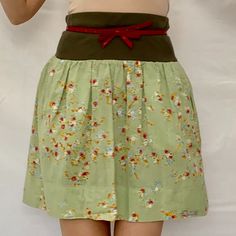 A Lovely Summer Skirt From Italian Brand Caractre C24. Cotton Lovely Colorful Small Flowers On A Most Beautiful Shade Of Green. Feels Soft And Very Comfy. Casual W: 14" L: 19.5" Plain Weave Floral Design Elasticized Waist Logo Plate 2 Side Pockets With Zippers! Military Green Elasticized Waist. Made In Italy. Size: 42/M/6 Fun Light And Colorful Skirt To Have In Your Closet For Summer Days! Caractre C24 Mini Skirt~ Green Floral ~ Light Coton ~ Italy ~Sz. 42/M~ Summer E 2232 6 Oz Green Cotton Mini Skirt For Summer, Green Cotton Bottoms With Gathered Skirt, Green Cotton Mini Skirt With Elastic Waistband, Summer Mini Skirt With Waistband, Casual Skirt With Waistband For Spring, Fitted Green Skirt With Elastic Waistband, Green Relaxed Mini Pleated Skirt, Spring Mini Skirt With Waistband, Green Cotton Pleated Mini Skirt