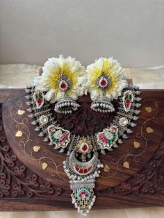 These Neckpiece made in pure brass , with silver and gold  polish to give it complete vintage vibes and intricated jadtar pachi kundan work all over the neck , with earrings.You can wear it on western wear traditionl look navratri wear.this chokar gives charm on your whole look. care: store in lock box or bag/allow loation or perfume dry before wearing/keep away from moisture Base of necklace made from high quality brass metal. PLEASE MENTION YOUR CONTACT NUMBER AT THE TIME OF PURCHASE ITS REQUI Festive Dual-tone Temple Jewelry Sets, Dual-tone Chandbali Jewelry For Puja, Bohemian Kundan Temple Necklace With Cutdana, Dual-tone Kundan Temple Jewelry Sets, Silver Dual-tone Kundan Necklace Temple Jewelry, Silver Dual-tone Kundan Necklace In Temple Jewelry Style, Dual-tone Kundan Chandbali Temple Necklace, Silver Dual-tone Chandbali Temple Necklace, Silver Dual-tone Temple Kundan Necklace